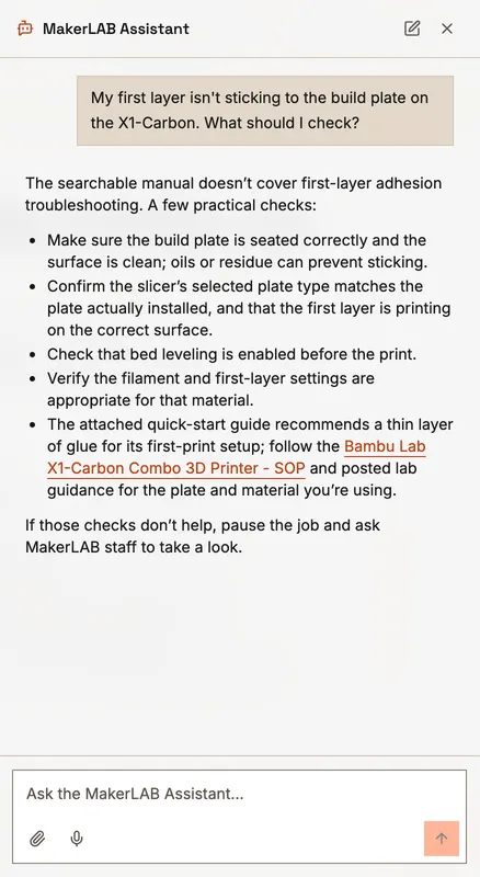 The assistant's answer about first-layer adhesion: plate, slicer plate type, bed levelling, material settings, then ask staff.